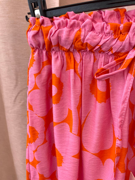 Calças pantalonas estampa flores rosa/laranja